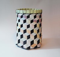 a basket with black and white squares on it